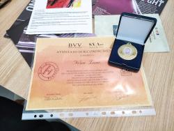 Diploma di partecipazione e medaglia